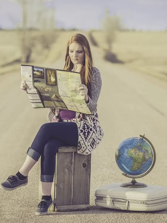 Girl on Road Trip with A Globe